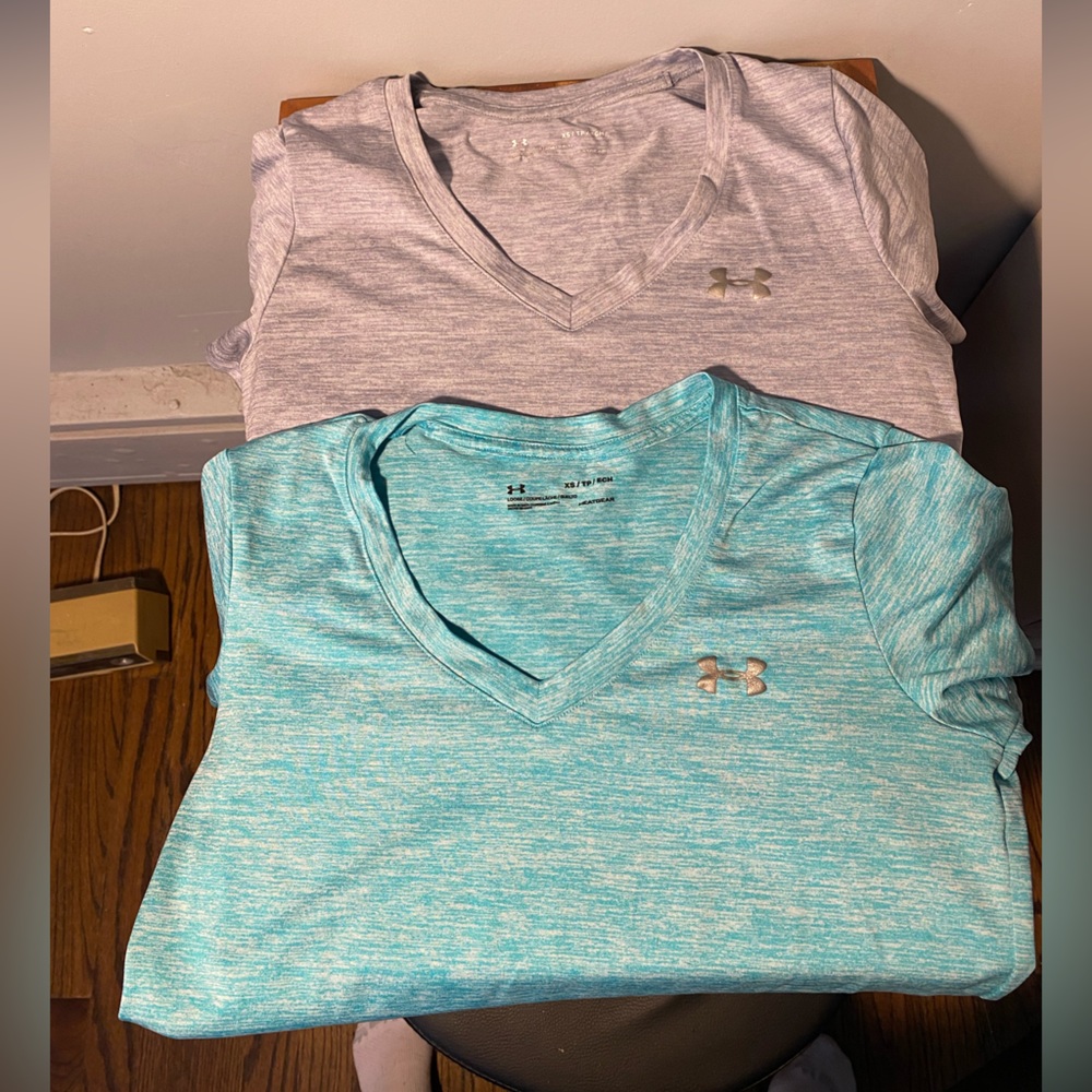 TWO Women’s XS UA V-neck tech tees.
